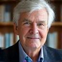 Professor Dr. Klaus Müller, an ethics professor from a reputable German university, in a thoughtful academic pose.
